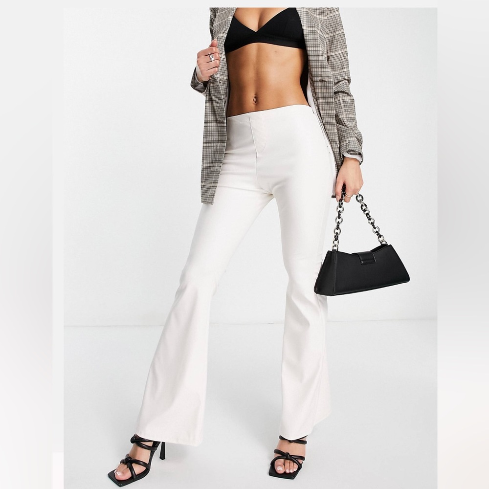 Low rise leather look flared pants with front seam in ecru